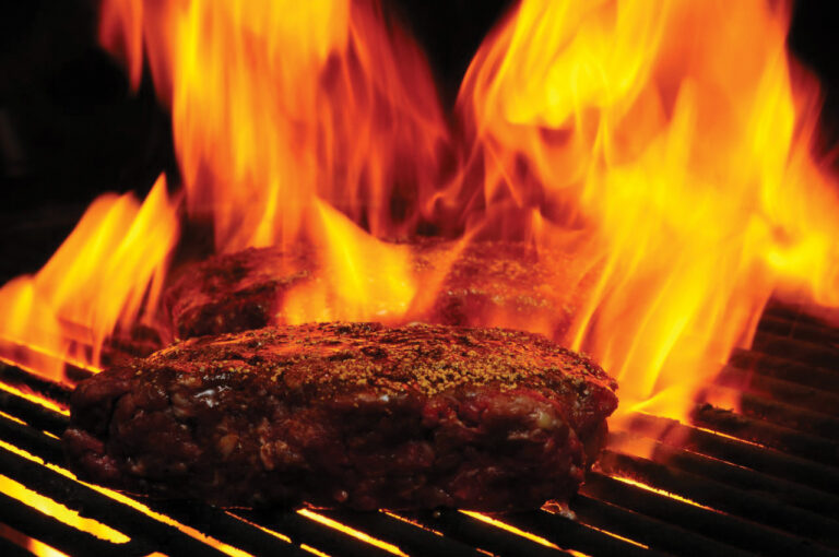 hamburger on a flame grill