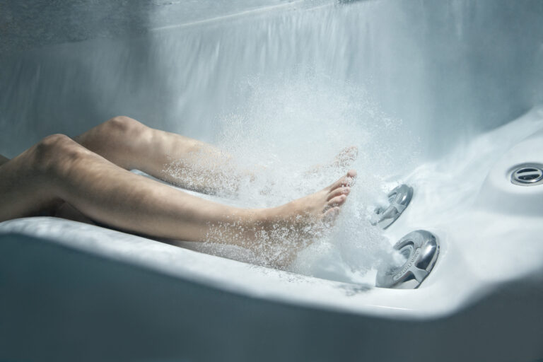 Person engaging in hot tub reflexology