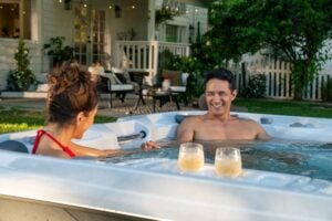 Coulple Relaxing in 880 searies spa 1 - Imagine Backyard Living