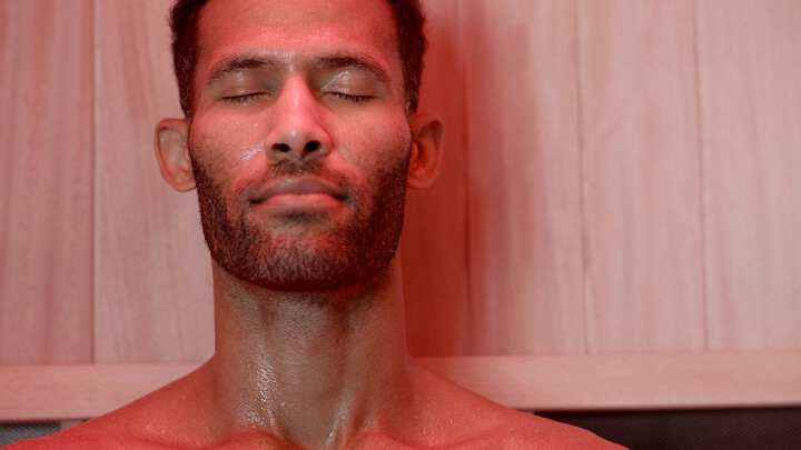 man in a jacuzzi infrared sauna with red light therapy - buy an infrared sauna in scottsdale