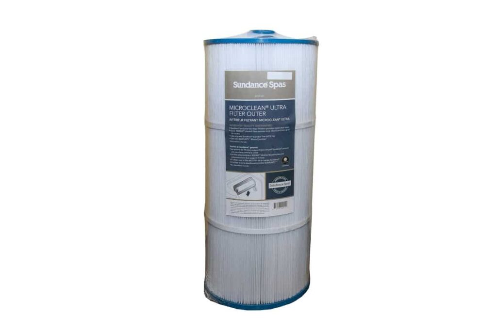 Cylindrical pool filter with blue end caps and a label reading 'Sundance Spas MicroClean Ultra Filter Outer' on the front.